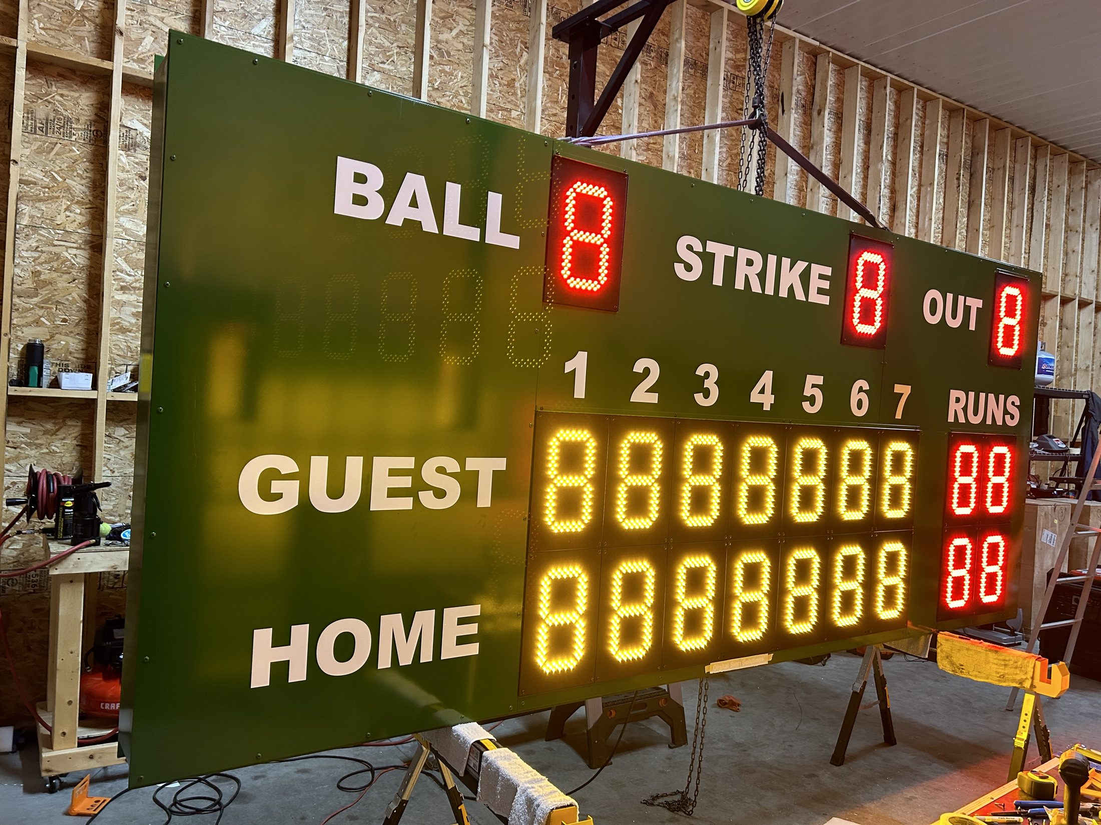 Fixed digit scoreboard illuminated during testing in the Digital Sign Solutions shop